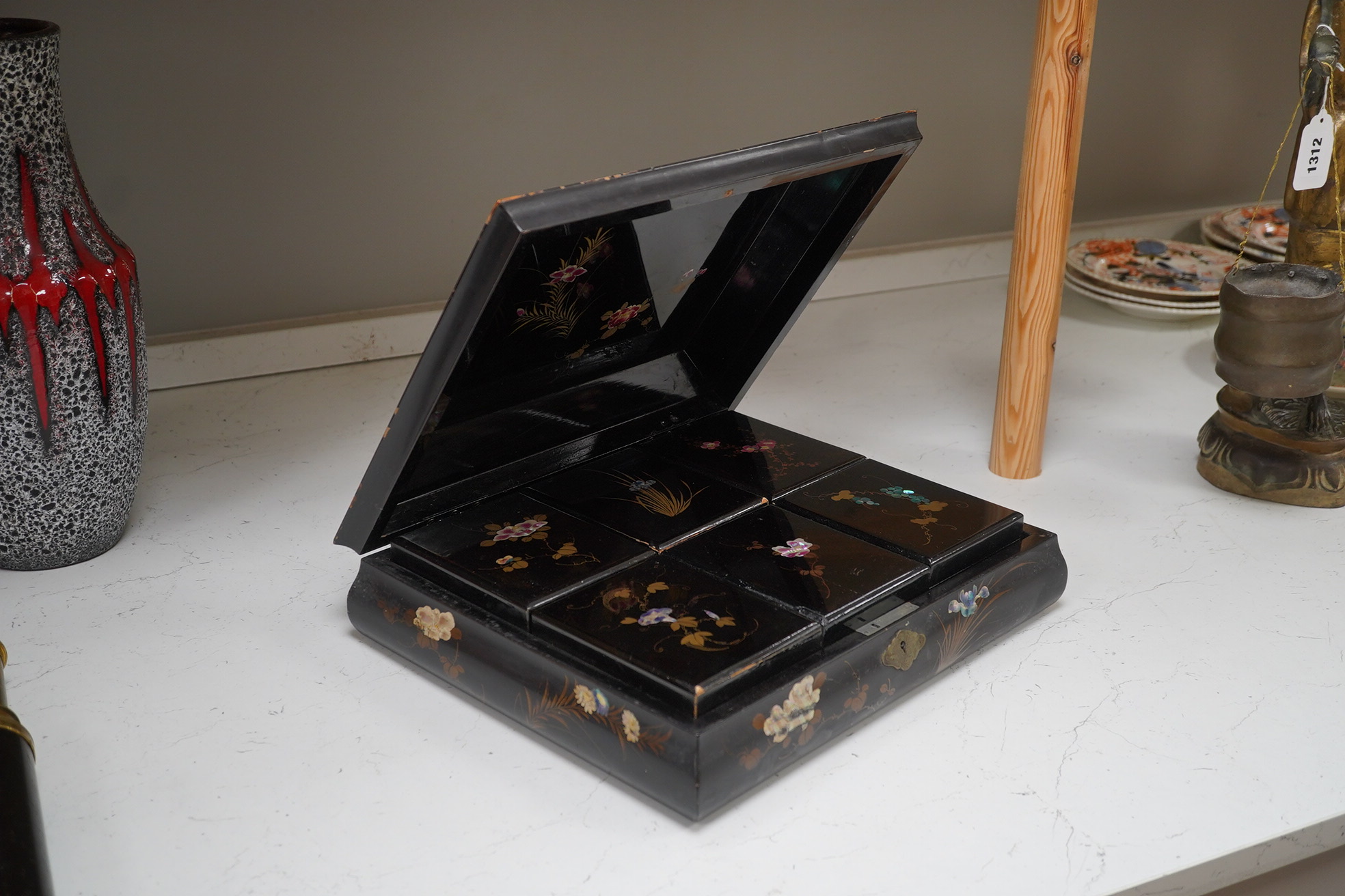 A Japanese lacquered box with mother of pearl inlay of birds and flowers, 35.5cm wide. Condition - worn on the outside to be expected, inside good